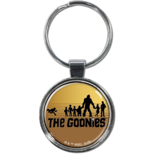 A round keychain with a gold background featuring a silhouette of a group of people and the text 'THE GOONIES'.